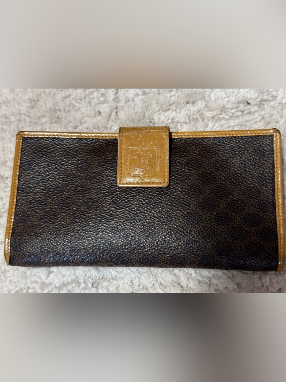 Authentic Celine Sleek brown long wallet with tan trim with snap closures!
